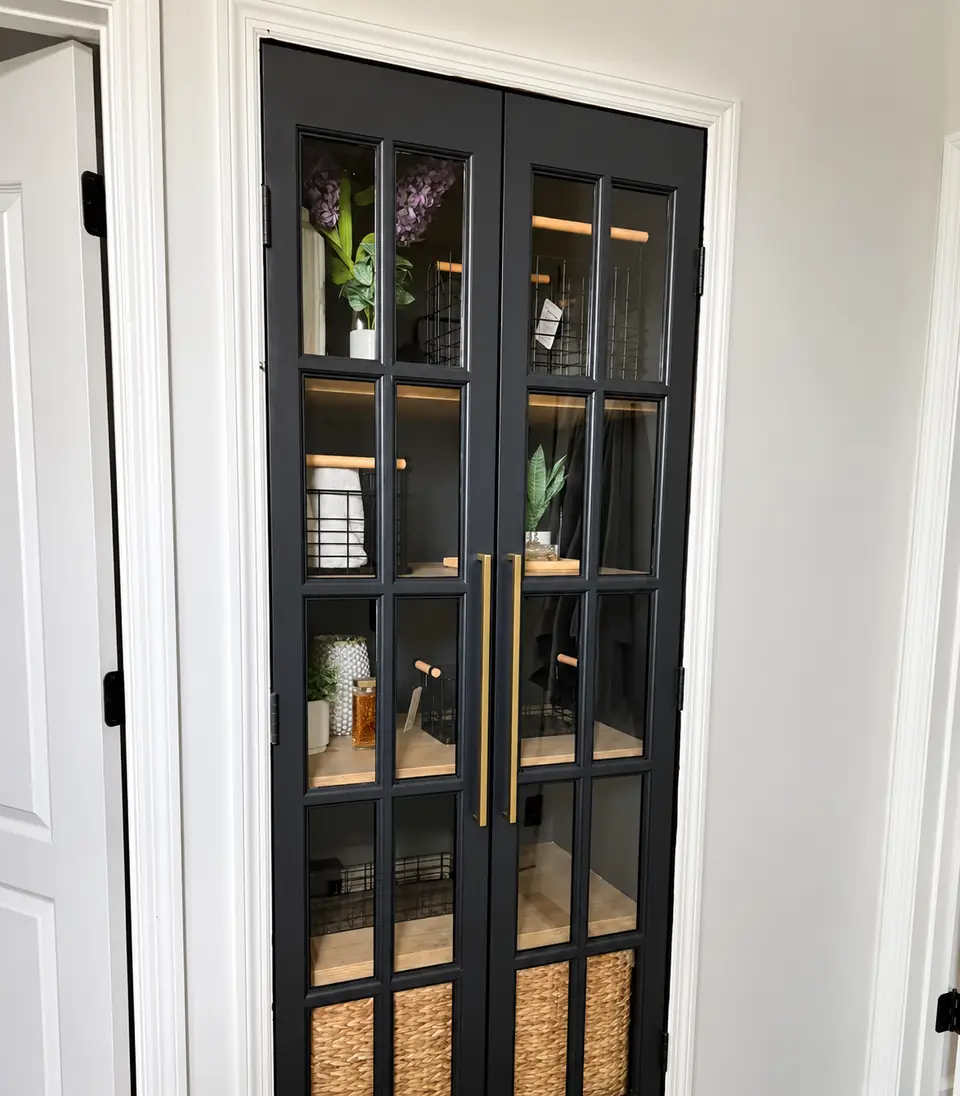 Black glass-panel French doors in a white casing